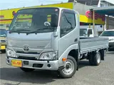 2022 Toyota Dyna Truck 1.25-ton 10-foot low-bed flatbed truck with reduced braking system, 5-speed manual transmission, standard driver's license acceptable. Silver Truck for sale, Japanese used car export - photo 1 of 43 | GULJI TRADERS