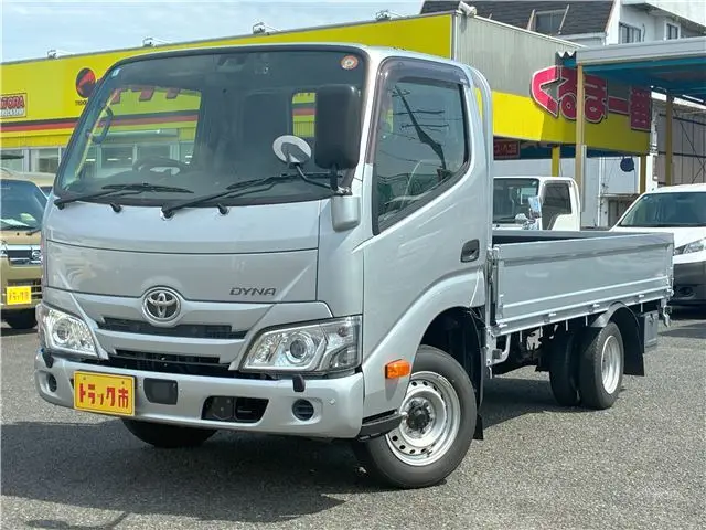 2022 Toyota Dyna Truck 1.25-ton 10-foot low-bed flatbed truck with reduced braking system, 5-speed manual transmission, standard driver's license acceptable. Silver Truck for sale, Japanese used car export - photo 1 of 43 | GULJI TRADERS