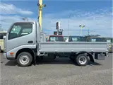 2022 Toyota Dyna Truck 1.25-ton 10-foot low-bed flatbed truck with reduced braking system, 5-speed manual transmission, standard driver's license acceptable. Silver Truck for sale, Japanese used car export - photo 3 of 43 | GULJI TRADERS