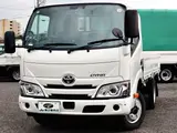 2022 Toyota Dyna Truck Flatbed, 2-ton load capacity, standard 10-foot body, low-floor design, gross vehicle weight less than 5 tons. White Truck for sale, Japanese used car export - photo 1 of 41 | GULJI TRADERS