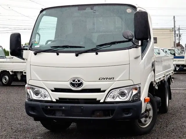 2022 Toyota Dyna Truck Flatbed, 2-ton load capacity, standard 10-foot body, low-floor design, gross vehicle weight less than 5 tons. - photo 1 2022 Toyota Dyna Truck Flatbed, 2-ton load capacity, standard 10-foot body, low-floor design, gross vehicle weight less than 5 tons. White Truck for sale, Japanese used car export - photo 1 of 6 | GULJI TRADERS