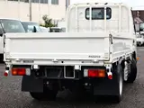2022 Toyota Dyna Truck Flatbed, 2-ton load capacity, standard 10-foot body, low-floor design, gross vehicle weight less than 5 tons. White Truck for sale, Japanese used car export - photo 2 of 6 | GULJI TRADERS