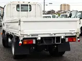 2022 Toyota Dyna Truck Flatbed, 2-ton load capacity, standard 10-foot body, low-floor design, gross vehicle weight less than 5 tons. White Truck for sale, Japanese used car export - photo 4 of 6 | GULJI TRADERS