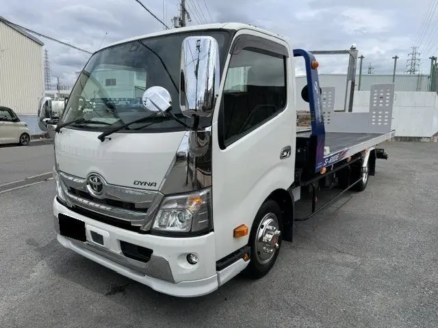 2023 Toyota Dyna Truck Car carrier, full flat, tire securing. - photo 1 2023 Toyota Dyna Truck Car carrier, full flat, tire securing. White Truck for sale, Japanese used car export - photo 1 of 5 | GULJI TRADERS
