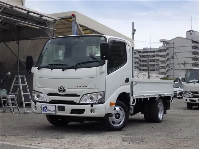 2023 Toyota Dyna Truck Flatbed, 4WD, 1.4t, 10ft, fully low-floor, manual transmission, diesel. - photo 1 2023 Toyota Dyna Truck Flatbed, 4WD, 1.4t, 10ft, fully low-floor, manual transmission, diesel. White Truck for sale, Japanese used car export - photo 1 of 43 | GULJI TRADERS