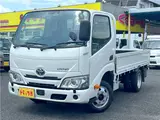 2025 Toyota Dyna Truck 1.4-ton 10-foot flatbed 4WD truck with reduced braking system and 5-speed manual transmission. White Truck for sale, Japanese used car export - photo 1 of 42 | GULJI TRADERS