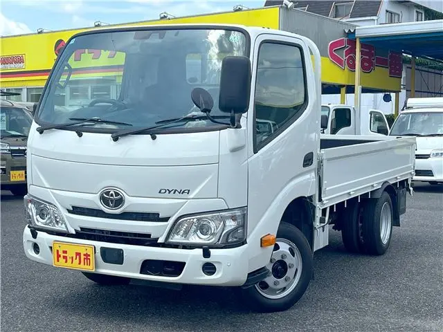 2025 Toyota Dyna Truck 1.4-ton 10-foot flatbed 4WD truck with reduced braking system and 5-speed manual transmission. White Truck for sale, Japanese used car export | GULJI TRADERS