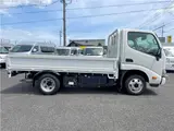 2025 Toyota Dyna Truck 1.4-ton 10-foot flatbed 4WD truck with reduced braking system and 5-speed manual transmission. White Truck for sale, Japanese used car export - photo 4 of 42 | GULJI TRADERS