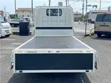 2025 Toyota Dyna Truck 1.4-ton 10-foot flatbed 4WD truck with reduced braking system and 5-speed manual transmission. White Truck for sale, Japanese used car export - photo 8 of 42 | GULJI TRADERS