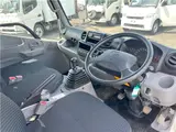 2025 Toyota Dyna Truck 1.4-ton 10-foot flatbed 4WD truck with reduced braking system and 5-speed manual transmission. White Truck for sale, Japanese used car export - photo 13 of 42 | GULJI TRADERS