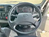 2025 Toyota Dyna Truck 1.4-ton 10-foot flatbed 4WD truck with reduced braking system and 5-speed manual transmission. White Truck for sale, Japanese used car export - photo 16 of 42 | GULJI TRADERS