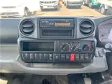 2025 Toyota Dyna Truck 1.4-ton 10-foot flatbed 4WD truck with reduced braking system and 5-speed manual transmission. White Truck for sale, Japanese used car export - photo 18 of 42 | GULJI TRADERS