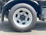 2025 Toyota Dyna Truck 1.4-ton 10-foot flatbed 4WD truck with reduced braking system and 5-speed manual transmission. White Truck for sale, Japanese used car export - photo 40 of 42 | GULJI TRADERS