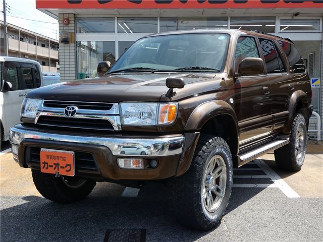 1998 Toyota Hilux Surf SSR-G full paint job, lift kit, aftermarket alloy wheels Brown Truck for sale, Japanese used car export | GULJI TRADERS