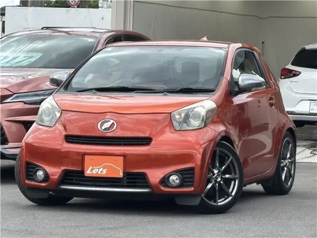 2010 Toyota IQ 130G MT → (Go) Leather Package - photo 1 2010 Toyota IQ 130G MT → (Go) Leather Package Orange Sedan for sale, Japanese used car export | GULJI TRADERS