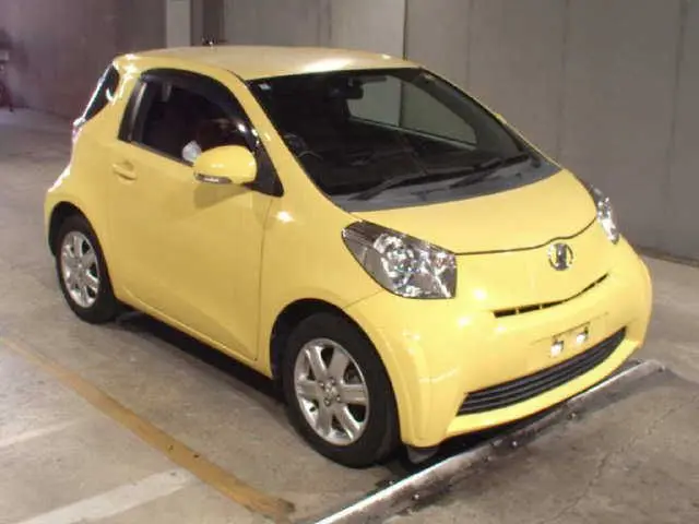 2010 Toyota IQ 100G - photo 1 2010 Toyota IQ 100G Yellow Sedan for sale, Japanese used car export - photo 1 of 7 | GULJI TRADERS
