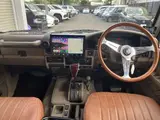 2025 Toyota Land Cruiser Prado SX Wide Black Jeep for sale, Japanese used car export - photo 3 of 9 | GULJI TRADERS
