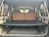 2025 Toyota Land Cruiser Prado SX Wide Black Jeep for sale, Japanese used car export - photo 6 of 9 | GULJI TRADERS