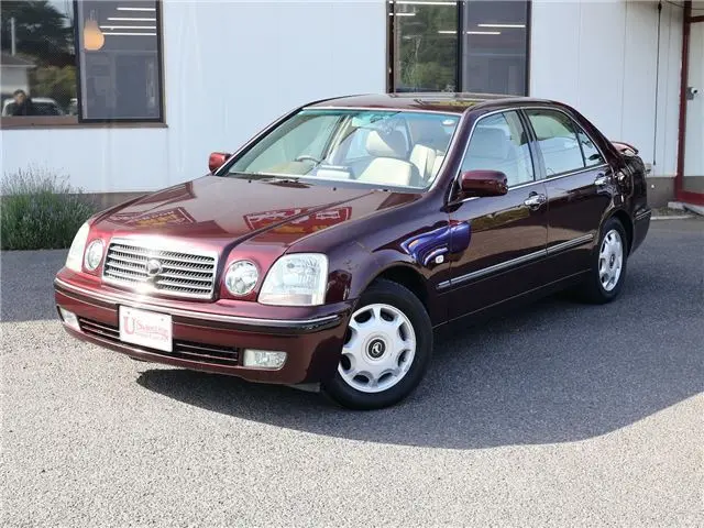 2005 Toyota Progres NC250 / Fully Automatic Passenger Seat Swivel Type A / Welcab / Rear Spoiler Brown Sedan for sale, Japanese used car export | GULJI TRADERS