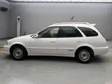 2002 Toyota Sprinter Carib S Touring Aero Sport 4WD White Sedan for sale, Japanese used car export - photo 5 of 13 | GULJI TRADERS