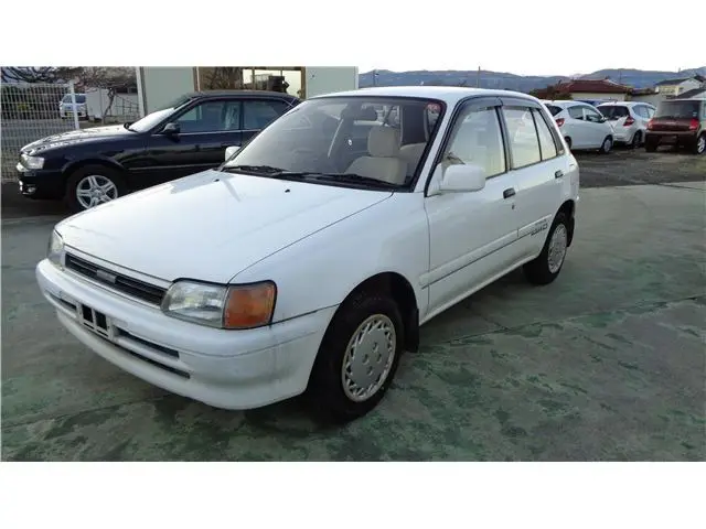 1990 Toyota Starlet X Limited 4WD 5MT White Sedan for sale, Japanese used car export | GULJI TRADERS