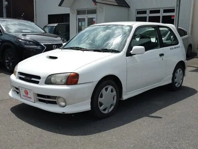 1997 Toyota Starlet Glanza V - photo 1 1997 Toyota Starlet Glanza V White Sedan for sale, Japanese used car export - photo 1 of 9 | GULJI TRADERS