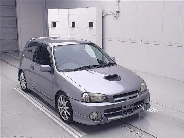 1998 Toyota Starlet Glanza V Turbo - photo 1 1998 Toyota Starlet Glanza V Turbo Gray Sedan for sale, Japanese used car export - photo 1 of 11 | GULJI TRADERS