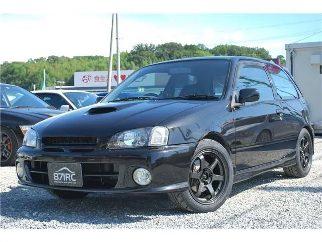 1999 Toyota Starlet Glanza V Excellent Package - photo 1 1999 Toyota Starlet Glanza V Excellent Package Black Sedan for sale, Japanese used car export - photo 1 of 32 | GULJI TRADERS